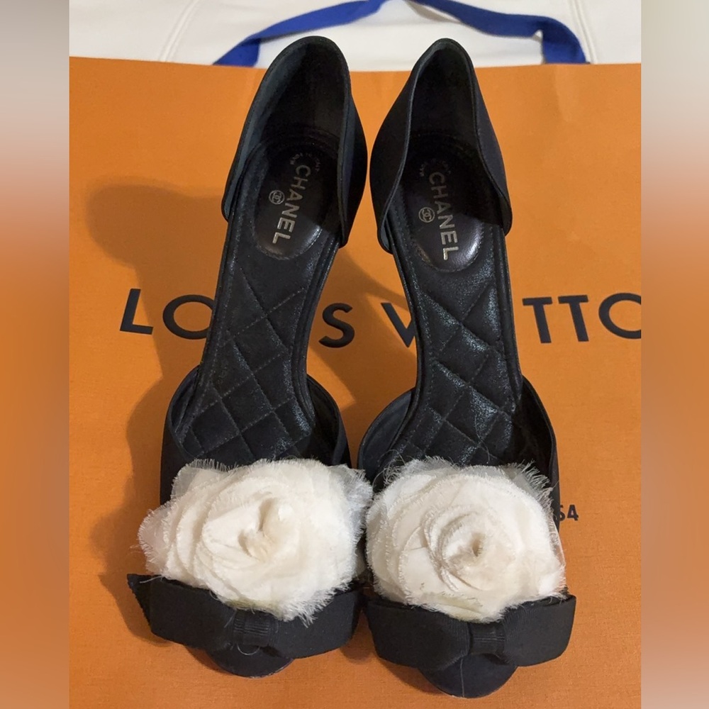 CHANEL Black Heels with White Floral Accent